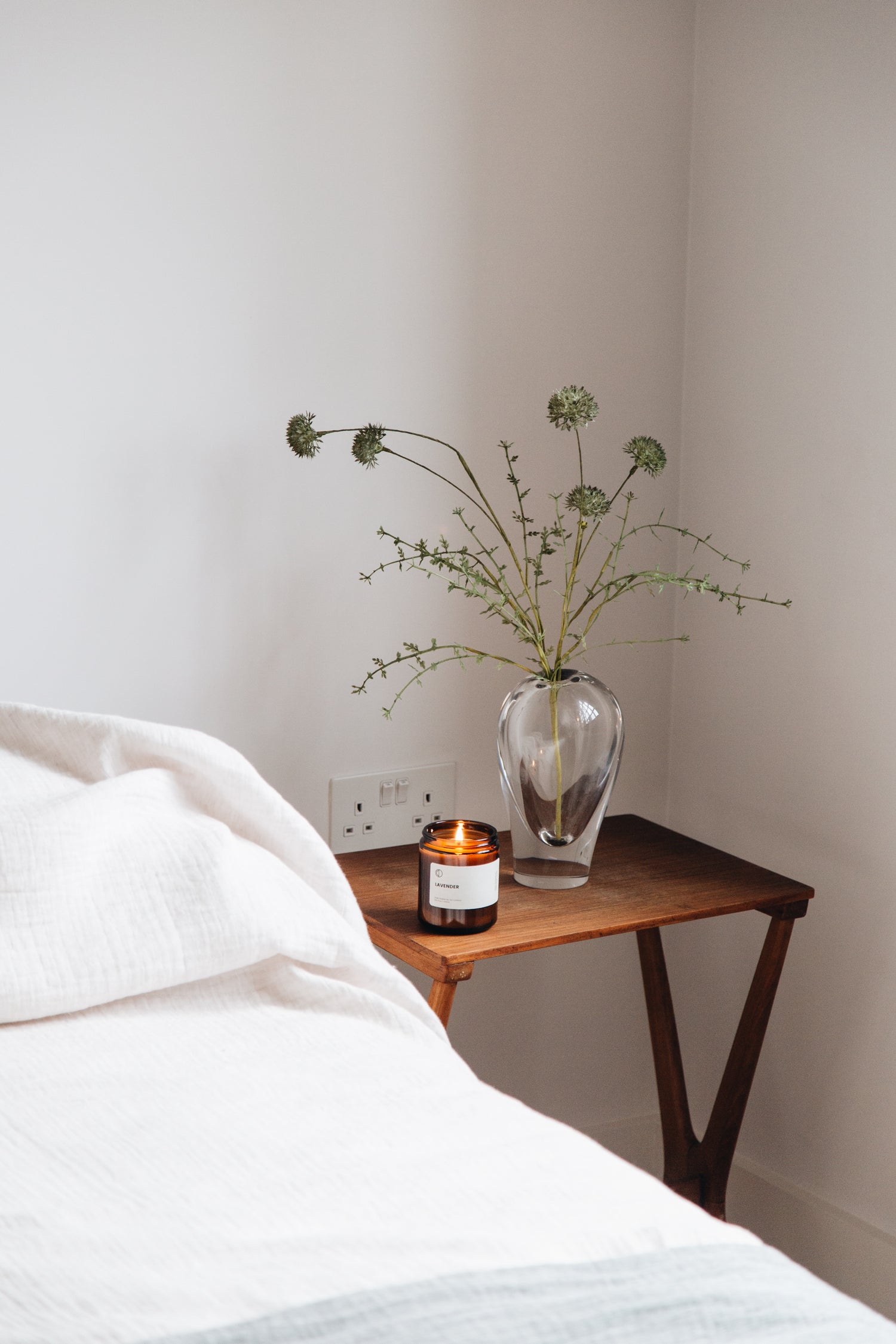 candle on bedside table