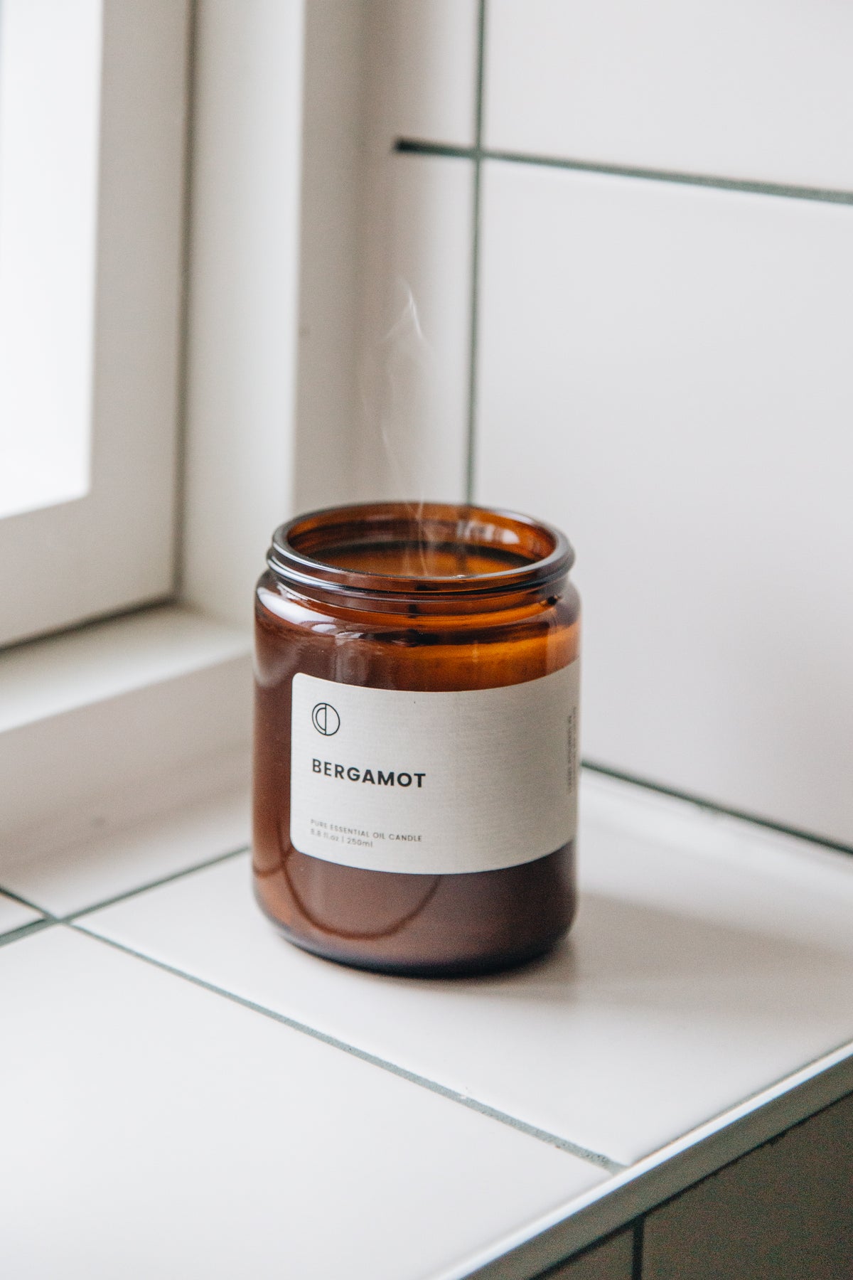 Bergamot essential oil candle in amber glass jar by OCTŌ