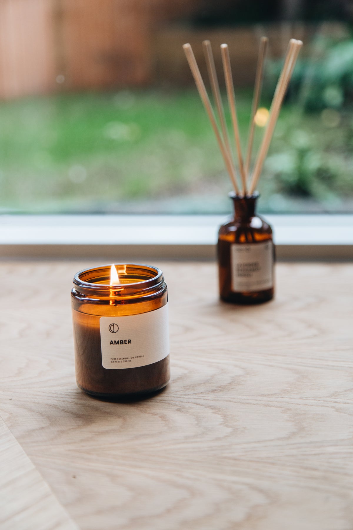 Amber essential oil candle in amber glass jar by OCTŌ