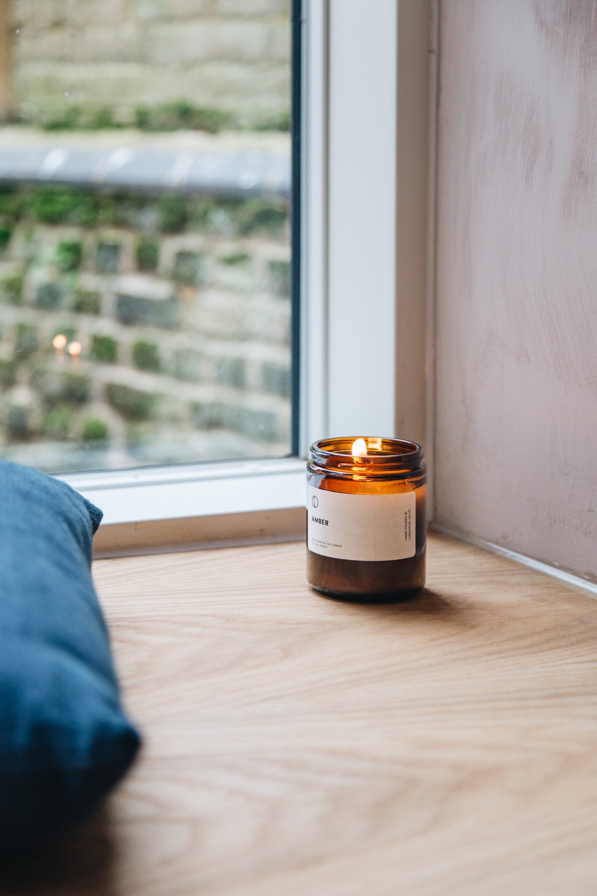 Amber essential oil candle in amber glass jar by OCTŌ