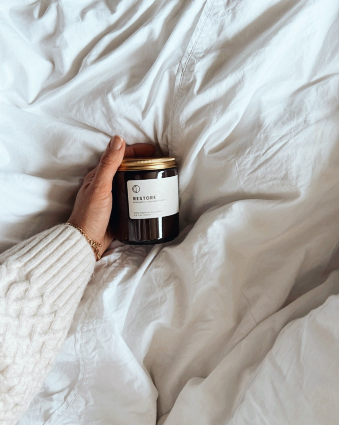 Restore essential oil candle in amber glass jar by OCTŌ