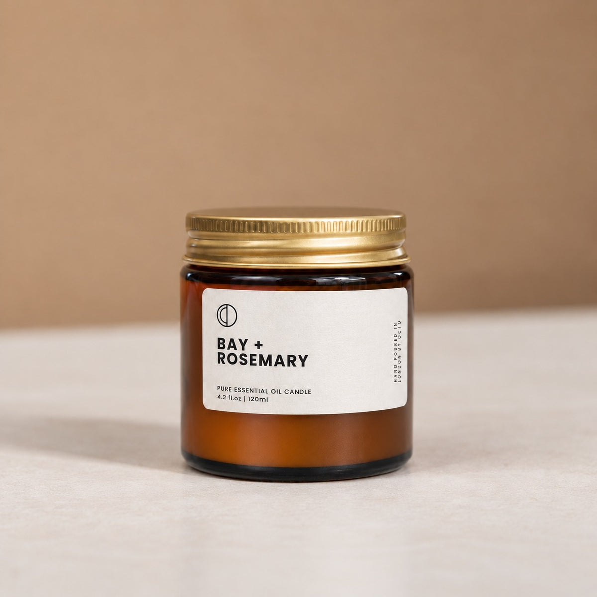 Bay and Rosemary essential oil candle in amber glass jar by OCTŌ