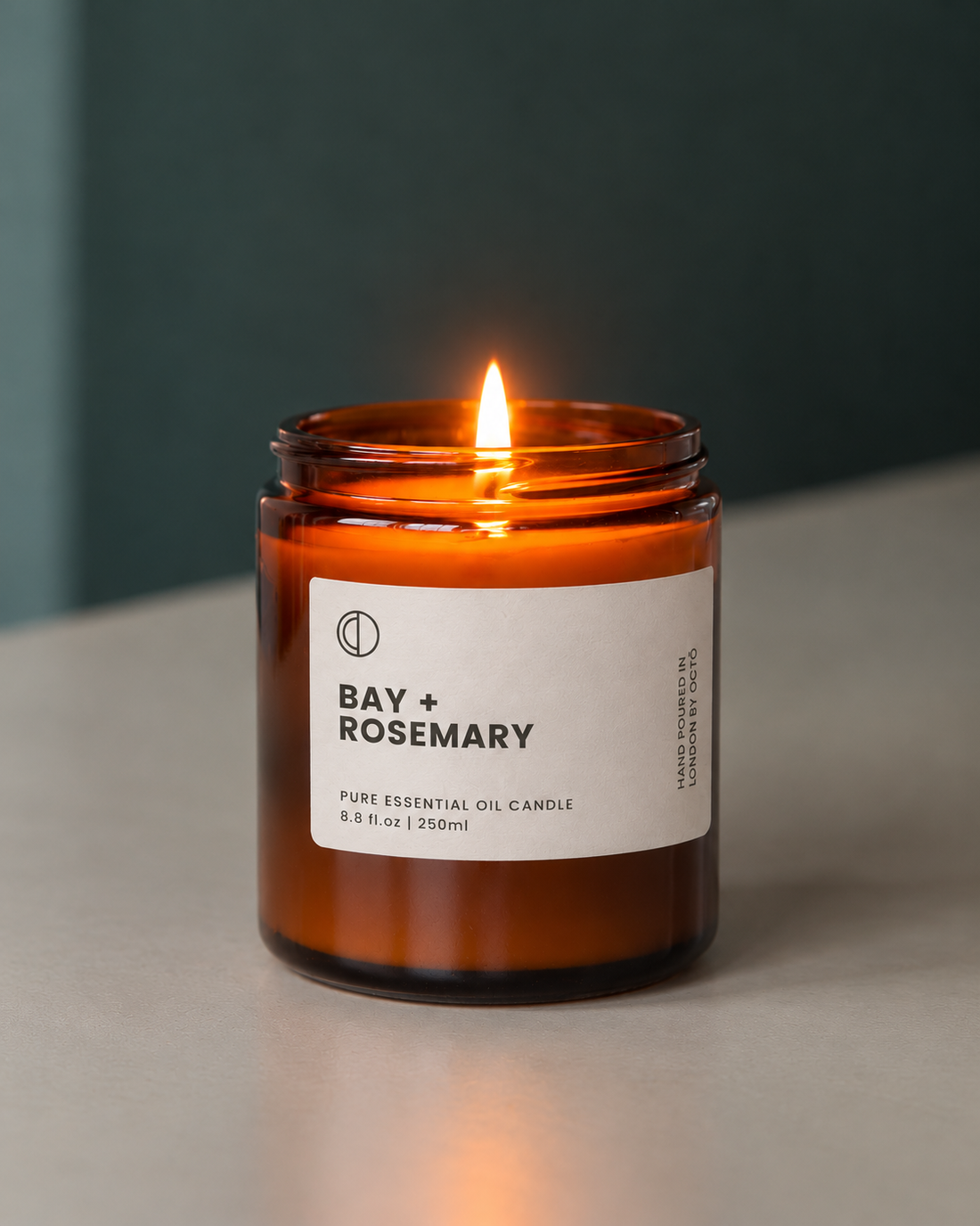 Bay and Rosemary essential oil candle in amber glass jar by OCTŌ