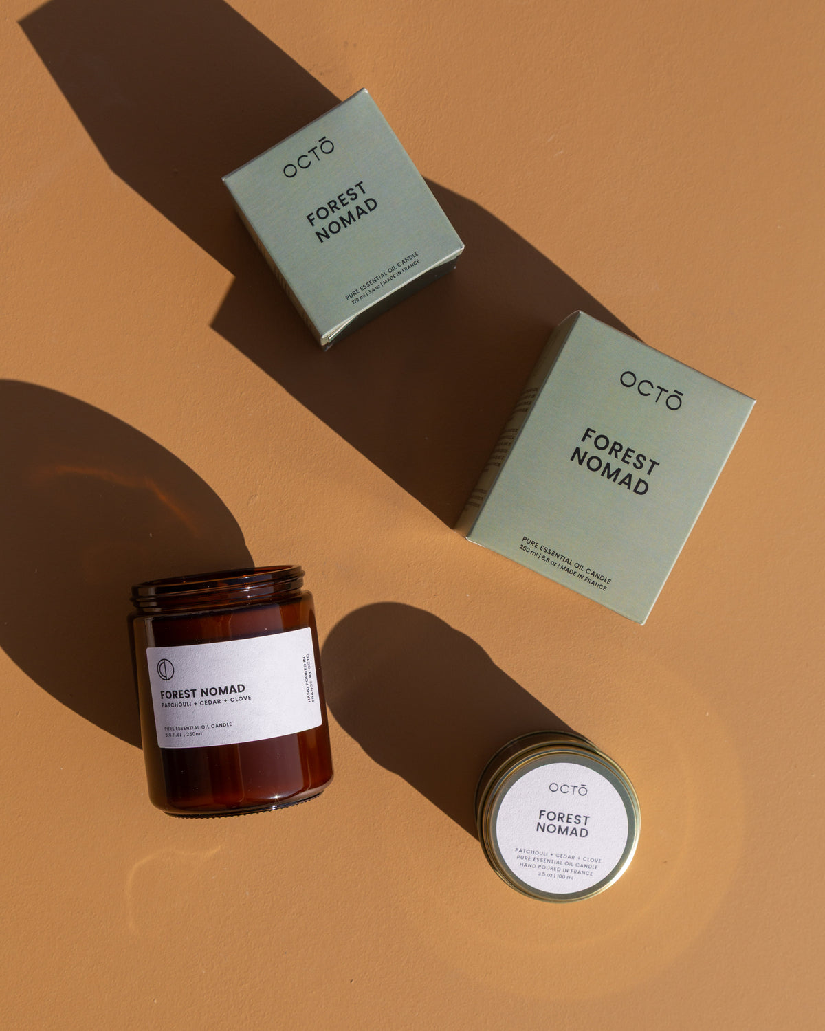 Forest Nomad essential oil candle in amber glass jar by OCTŌ