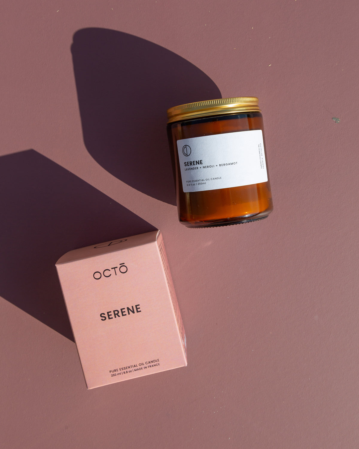 Serene essential oil candle in amber glass jar by OCTŌ