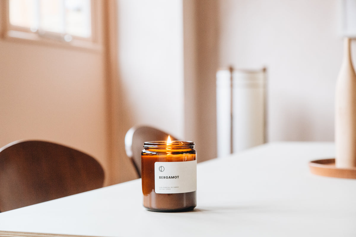 Bergamot essential oil candle in amber glass jar by OCTŌ