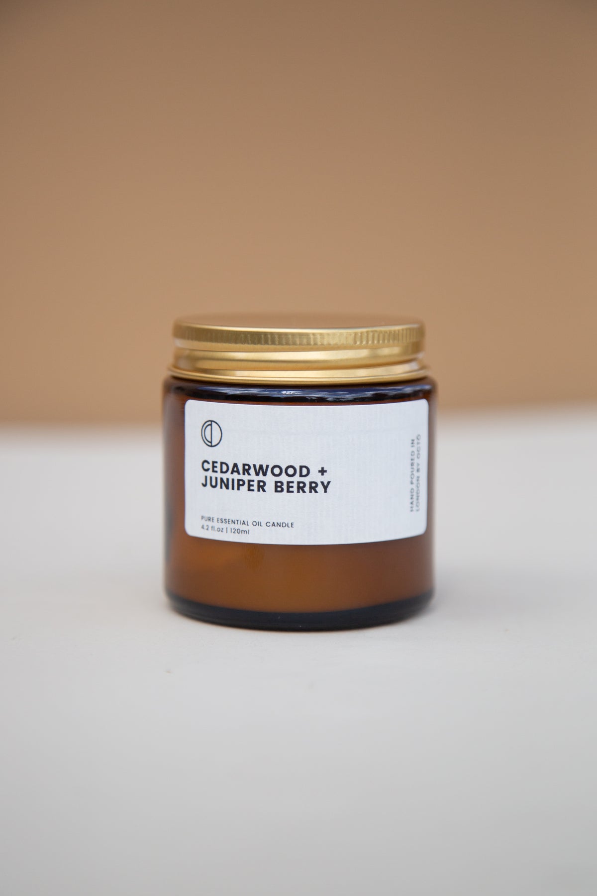 Cedar and Juniper essential oil candle in amber glass jar by OCTŌ