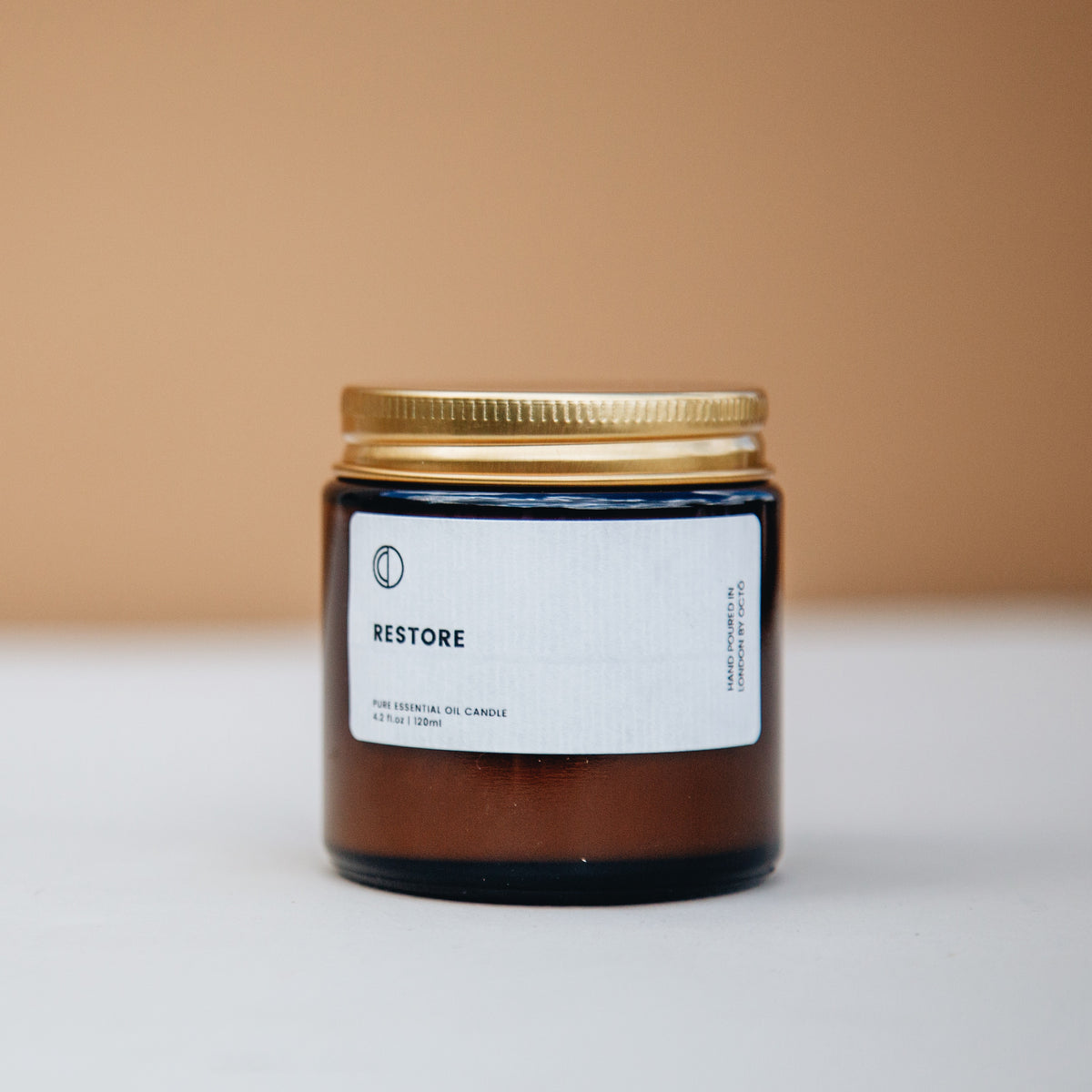 Restore essential oil candle in amber glass jar by OCTŌ