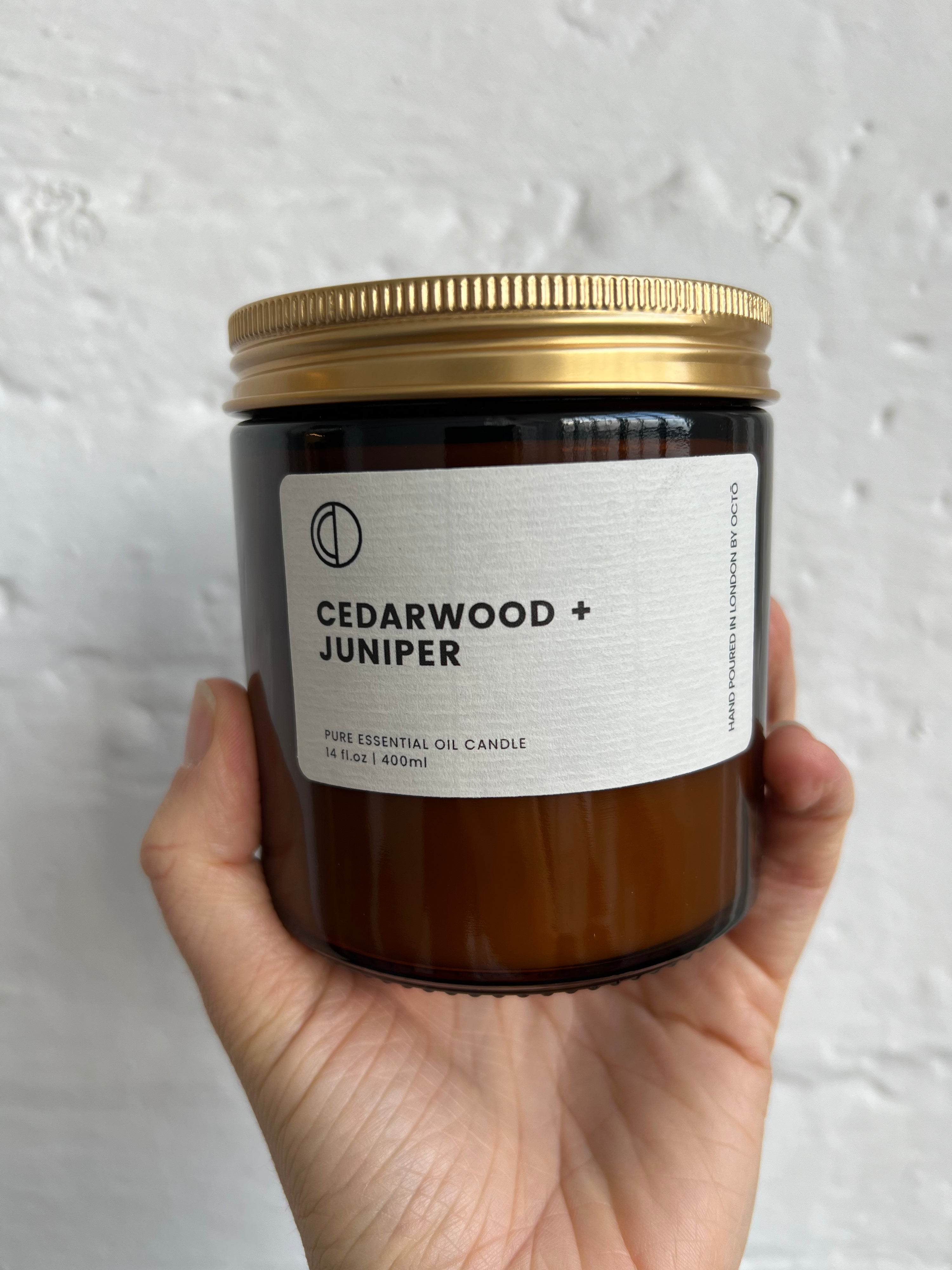 Cedar and Juniper essential oil candle in amber glass jar by OCTŌ
