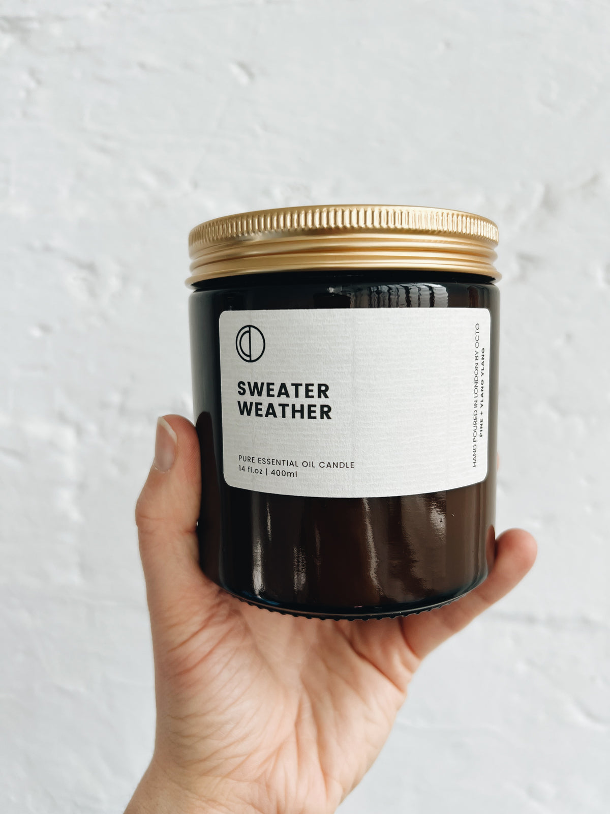 Sweater Weather essential oil candle in amber glass jar by OCTŌ