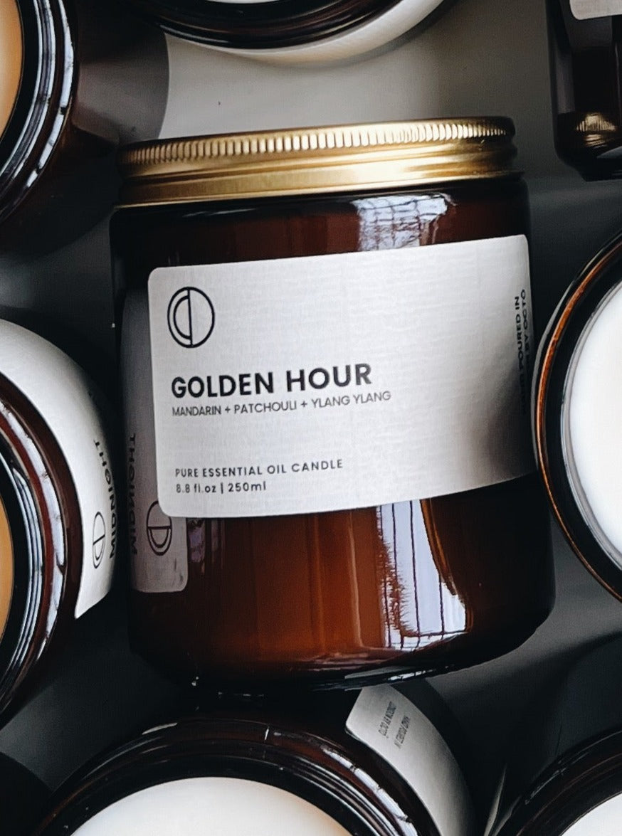 Heure dorée (Mandarine + Patchouli + Ylang-ylang) | Bougie en pot ambré
