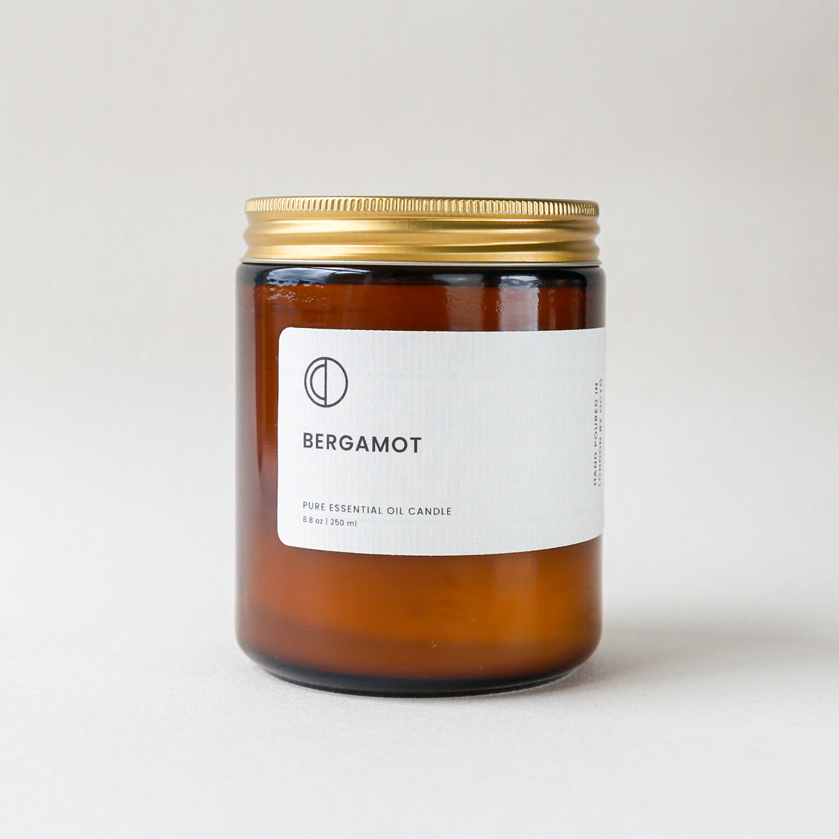 Bergamot essential oil candle in amber glass jar by OCTŌ