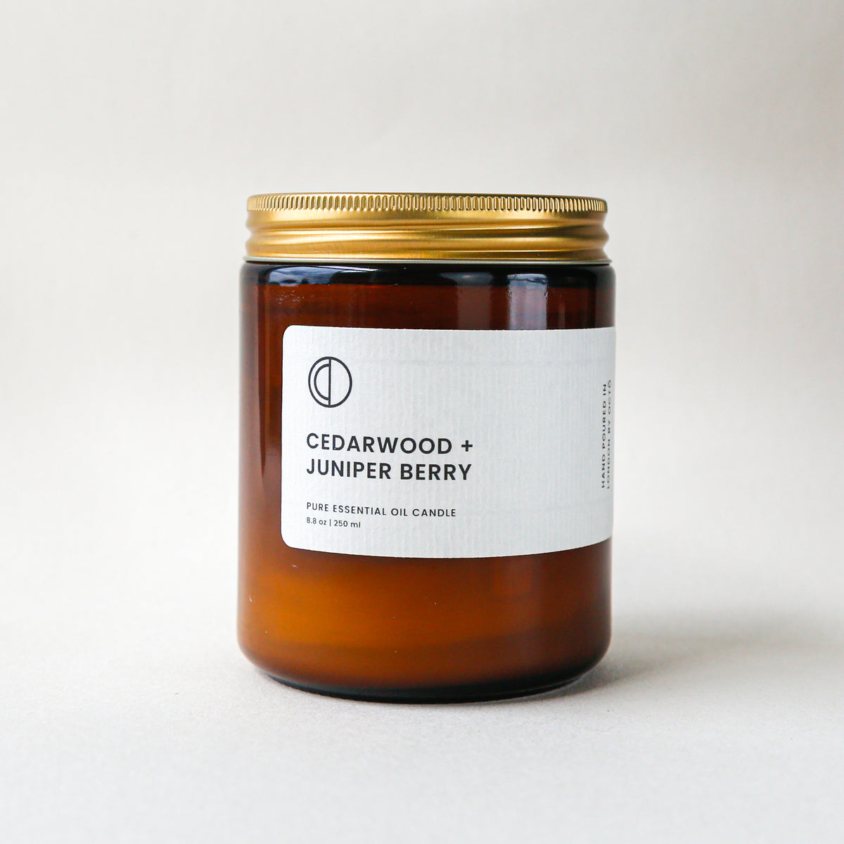 Cedar and Juniper essential oil candle in amber glass jar by OCTŌ