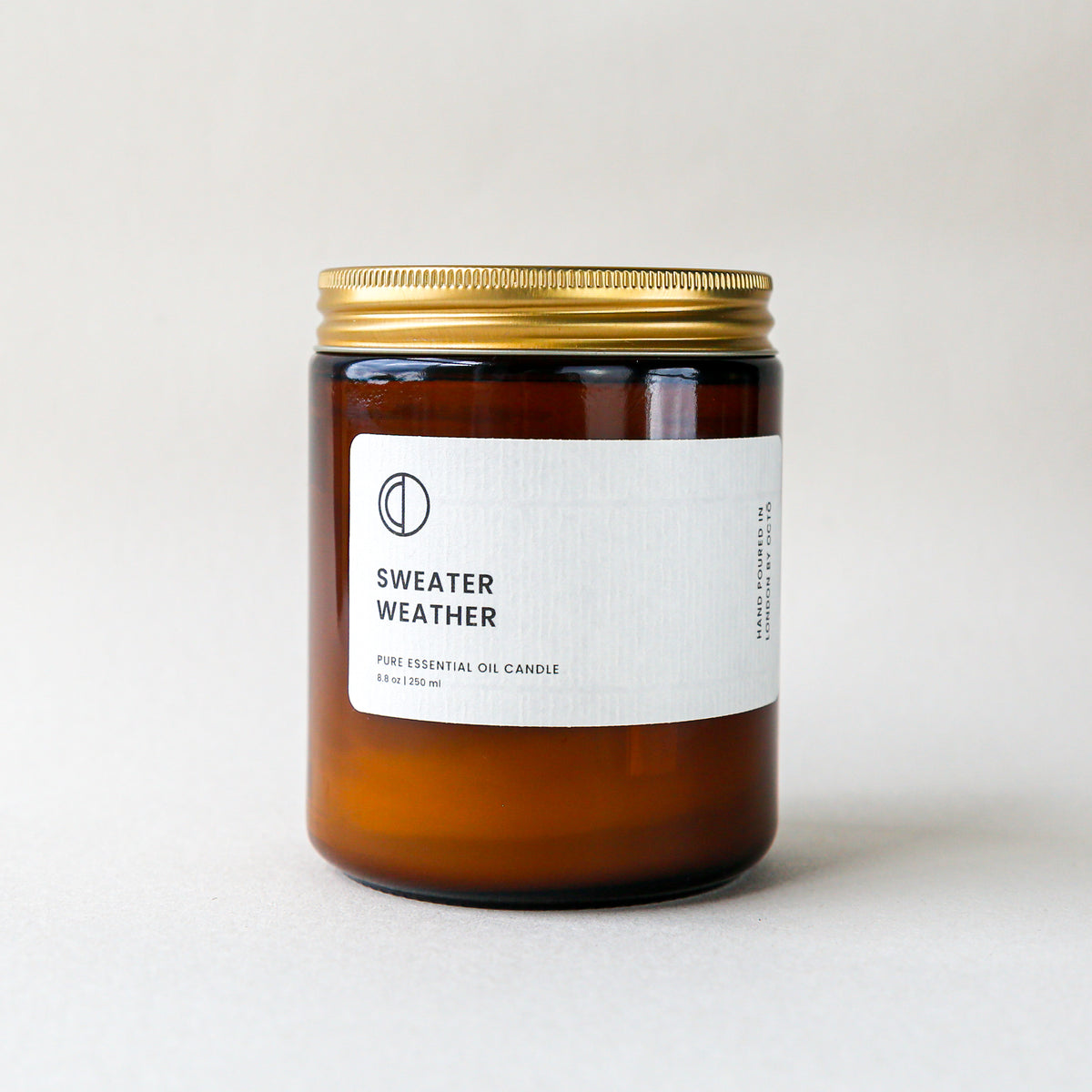 Sweater Weather essential oil candle in amber glass jar by OCTŌ